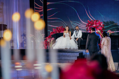 Middle eastern bride and groom taking couple photos at the walk dinsye concert hall in los angeles muslim bride