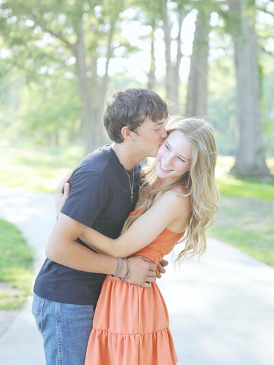 an engaged couple at a park