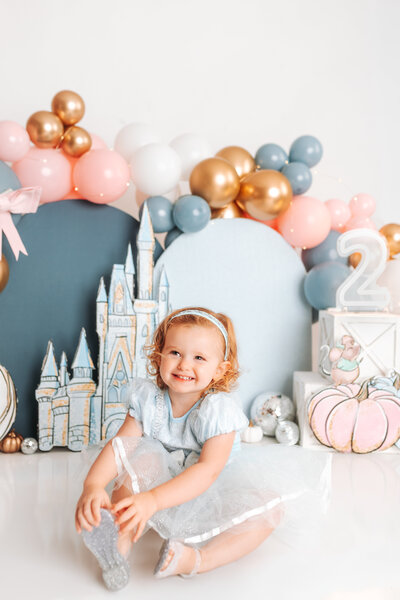 Mom and dad hold baby boy close to their chest in a newborn studio