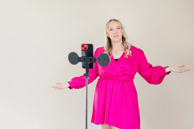 Becca recording herself speak with her video recording equipment 