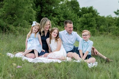 family in nursery playing for photography session