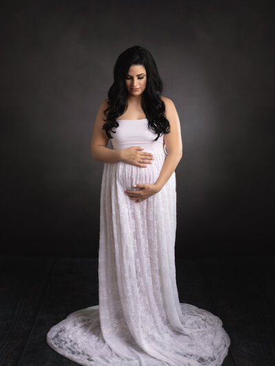 portrait of pregnant mom holding belly