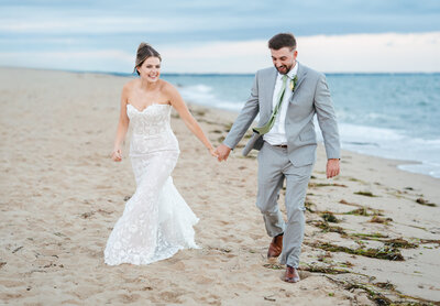 Cape Cod Popponesset Inn wedding photos featuring beachfront scenery and candid emotional moments.