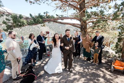 A bride and groom moments after saying their vows walk away from their ceremony in mammoth lakes. 