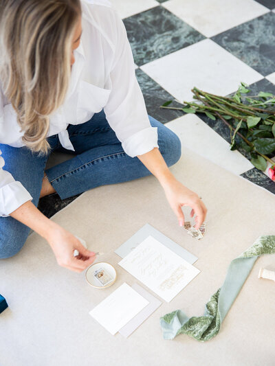 styling an invitation set for a flat lay