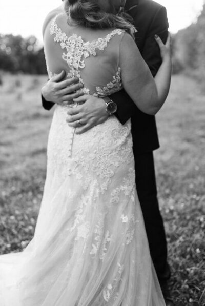 Bride  pulling lace sleeves down