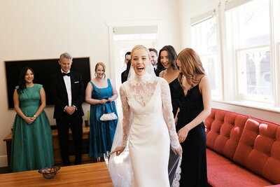 detail shot of brides sunglasses jewelry shoes and veil