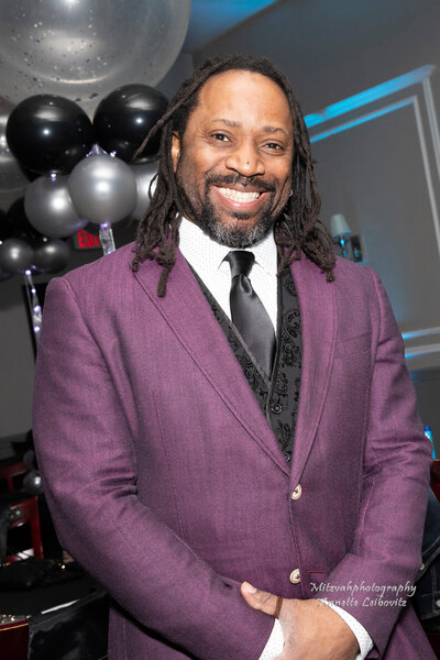 Portrait of DJ Marz in a suit 