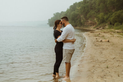 A private couples session at a private beach in Stillwater, Minnesota. Brittany and Kasey cuddle up together along the shoreline and give each other a few eskimo kisses.