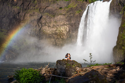 Surprise wedding proposal lgbtqia+ photography with waterfall and rainbow in Seattle Washington