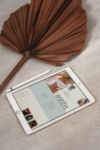 Karina Canva branding kit and Showit website template for wellness coaches, shown in a natural woven mockup with logo, color palette, and modern editorial design elements.