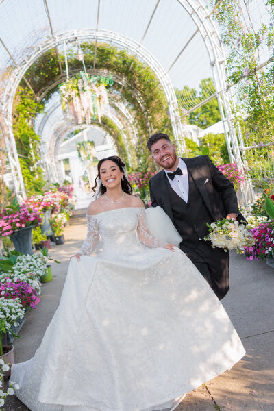 Bride and groom under veil