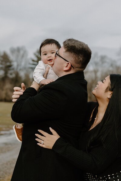 dad kissing son