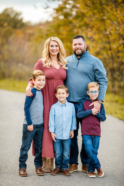 SC interior designer Priscilla Ertel poses for a family portrait with her husband and three sons