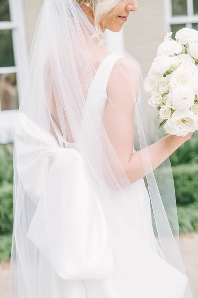 Stunning bride poses wearing her wedding gown