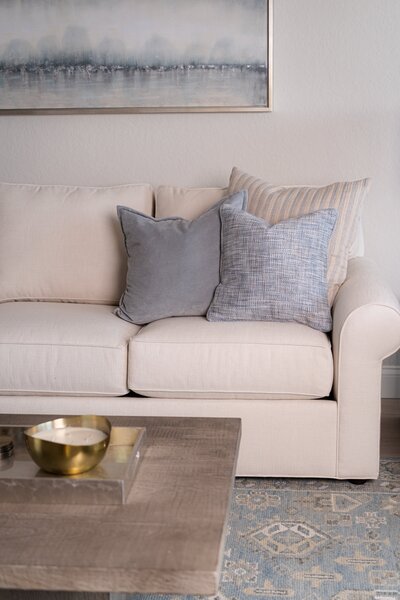 Cream couch with blue accents_Scarbro Design