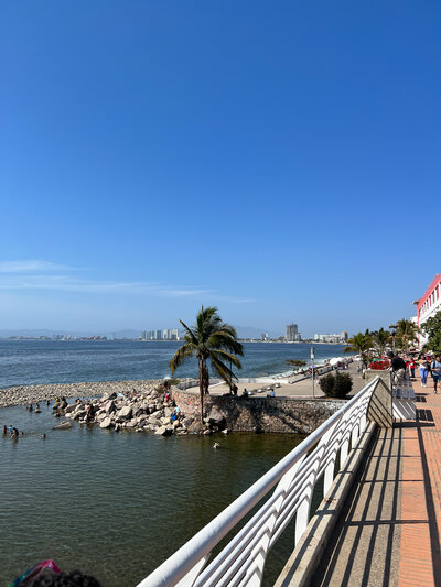 An enchanting view of the ocean from a bridge, creating a stunning setting for a destination wedding, filled with natural elegance.