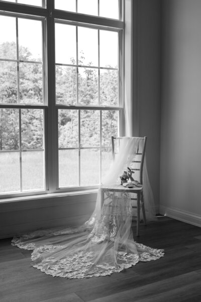 Wedding day detail photo of the brides wedding shoes and vail in the Cincinnati wedding venue