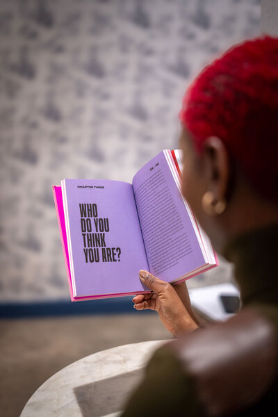 Nikisha reading her book about making money