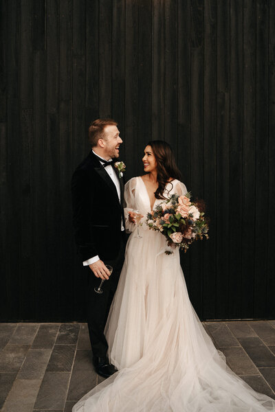 bride and groom laughing after their wedding ceremony