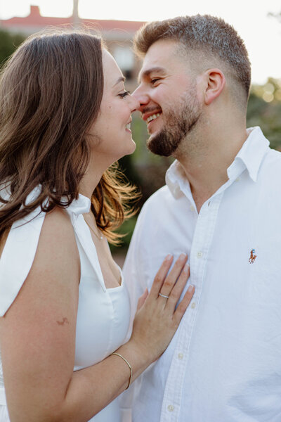 A couple standing face to face almost kissing