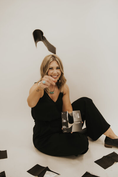 hair color specialist throwing foils at camera 