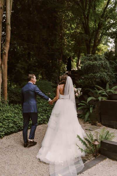 Bride and groom holding hands after ceremony