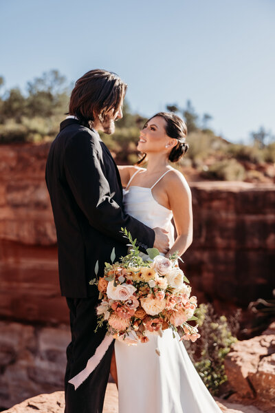 Bride in Dallas about to throw her bouquet to the wedding party, captured by Alex Blair Wedding Photography.