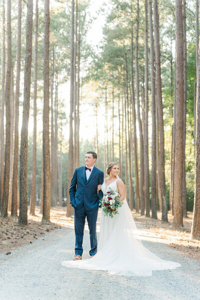 Newlyweds Mark and Emily underneath Carrigan Farms' willow tree captured by Charlotte NC wedding photographer