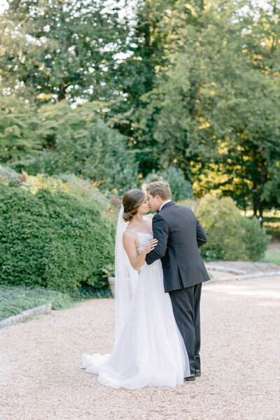 Virginia Wedding Photographer, Couple kissing on stone path