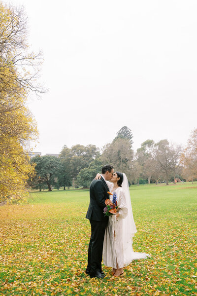 Isaac and Hannah kissing on their wedding day