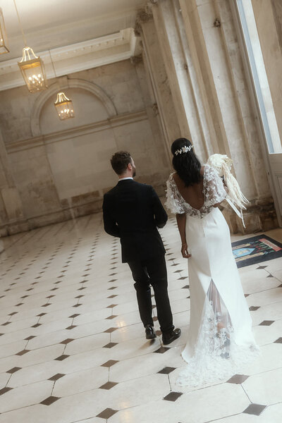 The back of a bride and groom at their Dublin City Hall wedding