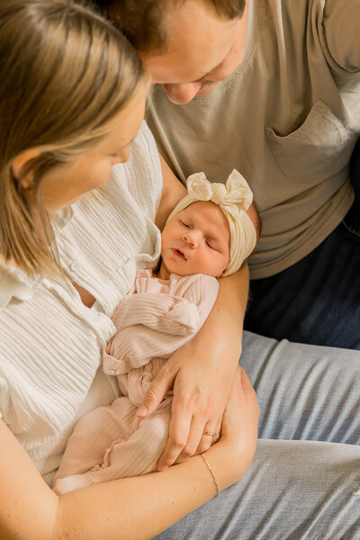 Newborn family lifestyle photos with mom and dad.