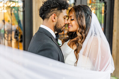 bride and groom about to kiss
