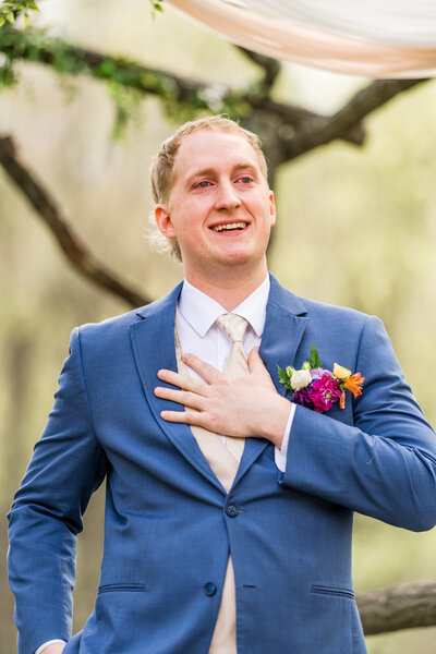 Groom, Alex Edwards, tearing up while his bride, Kassie, walks down the aisle. The sweetest groom reaction.