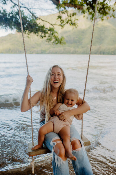 mother and daughter swinging