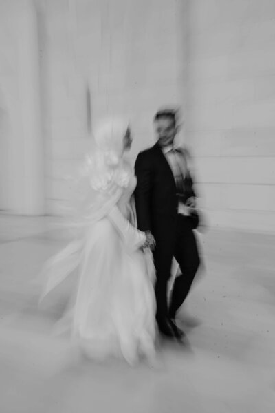 Blurry image of a bride and groom in black and white representing the artistic vision of bridal show vendors participating in the Crush Collective.