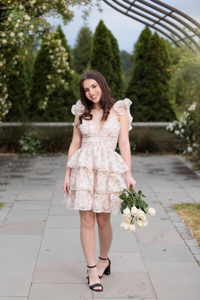 Chapel Hill high school senior with white roses.