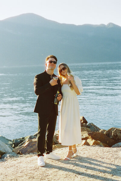 A couple celebrates their elopement with champaigne