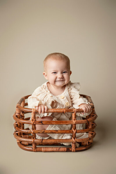 Six month old girl in basket.