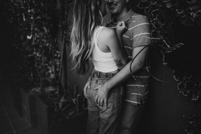 out of focus, j & j holding hands running on rooftop