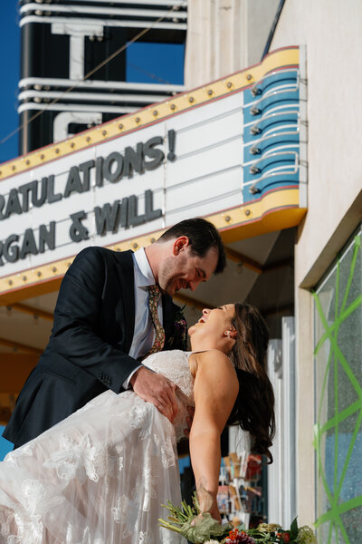 A groom dipping a bride