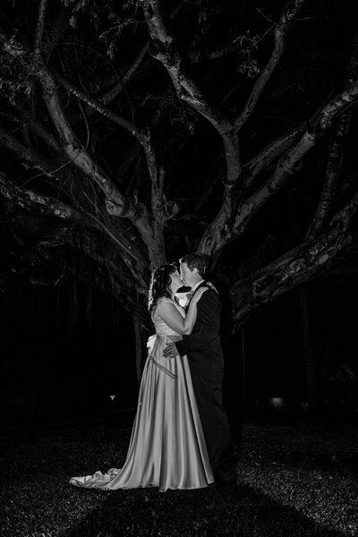 A joyful wedding scene in Ravenshoe, featuring a couple surrounded by colourful confetti, capturing a moment of celebration.