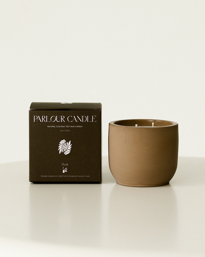 Parlour Candle is a handcrafted candle and home decor line created in a 100-year-old studio space. Using 100% natural coconut soy wax and high-quality, paraben- and phthalate-free fragrance oils, each candle vessel and decor piece is handmade with natural earth pigments and concrete. The line emphasizes sustainability, featuring fully recyclable vessels and no excess plastic in the packaging.