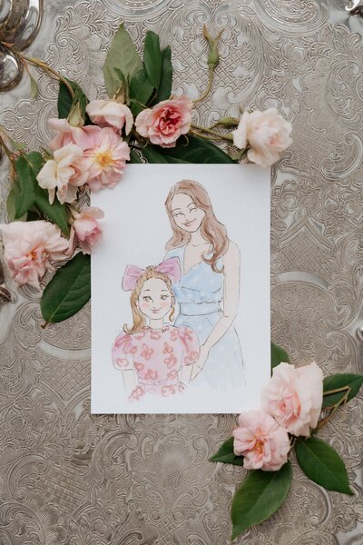 A watercolor illustration of a mother and daughter, surrounded by pink roses.
