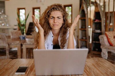 Woman throwing her hands in the air in frustration