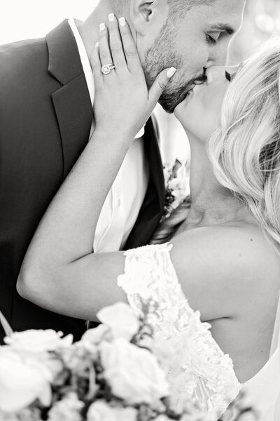 Brides walking through field laughing with each other in their wedding dresses