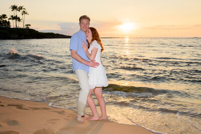 Couple laughs during sunset for their Maui photo session