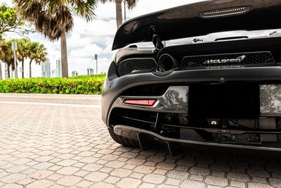 mclaren-720s-spider-convertible-black-for-rent-in-miami-rear-carbon-fiber-bumper-012