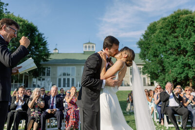 couple sharing first kiss at Veritas Vineyard in Charlottesville